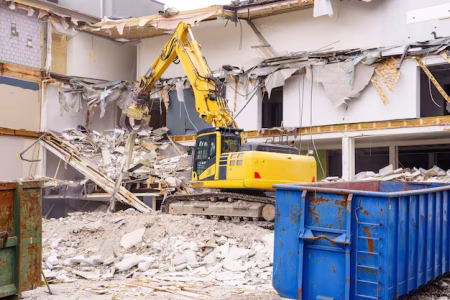 hydraulic excavator working demolition old industrial building 29285 264
