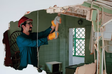 young worker with red protection helmet wearing blue boiler suit demolition concept 1194 12582